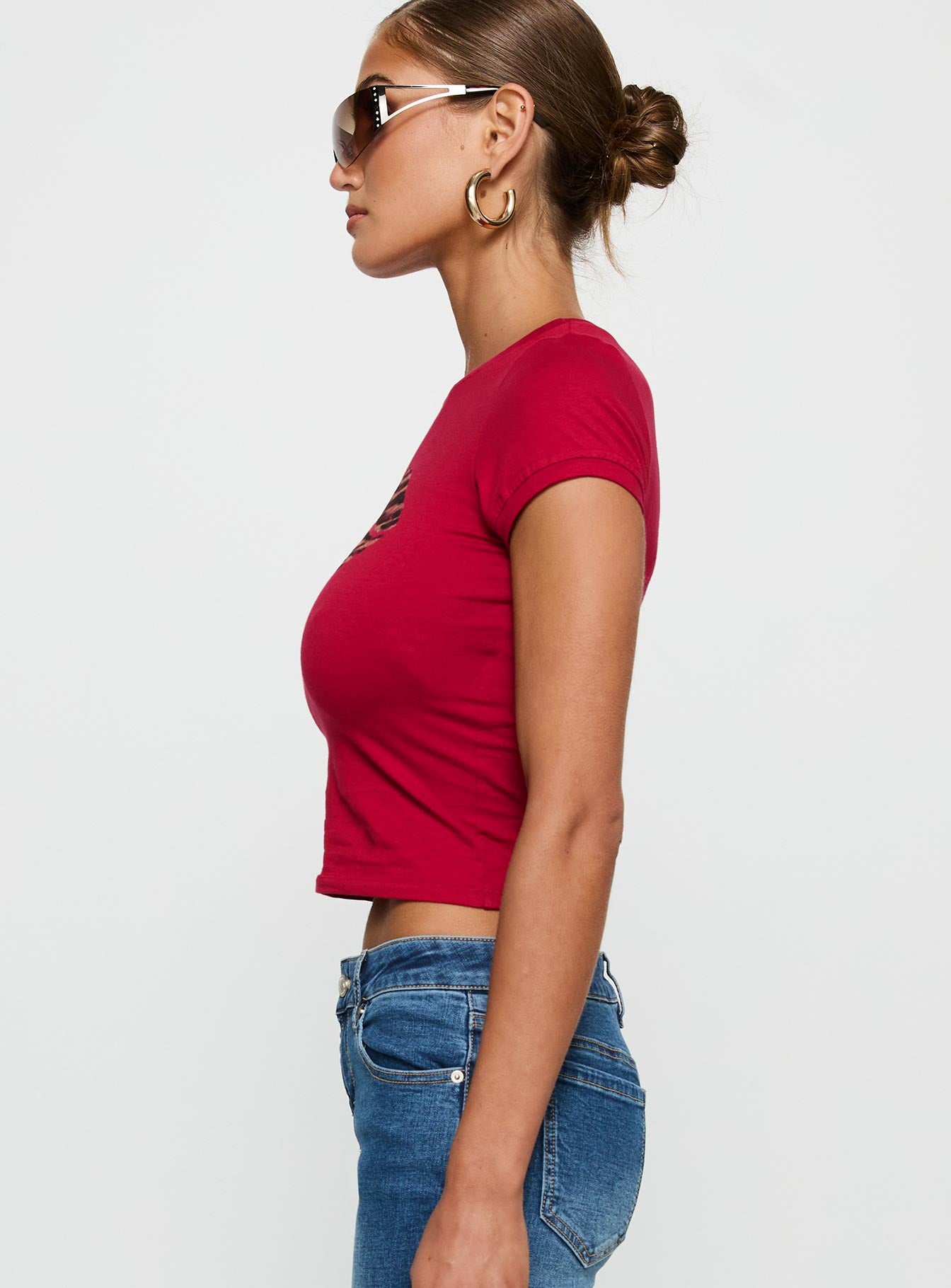 side view of model wearing Princess Polly Sutin Tee Red Short Sleeves Crew Neck 