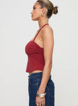 side view of model wearing Princess Polly Nexus Top Red Sleeveless Square Neck 