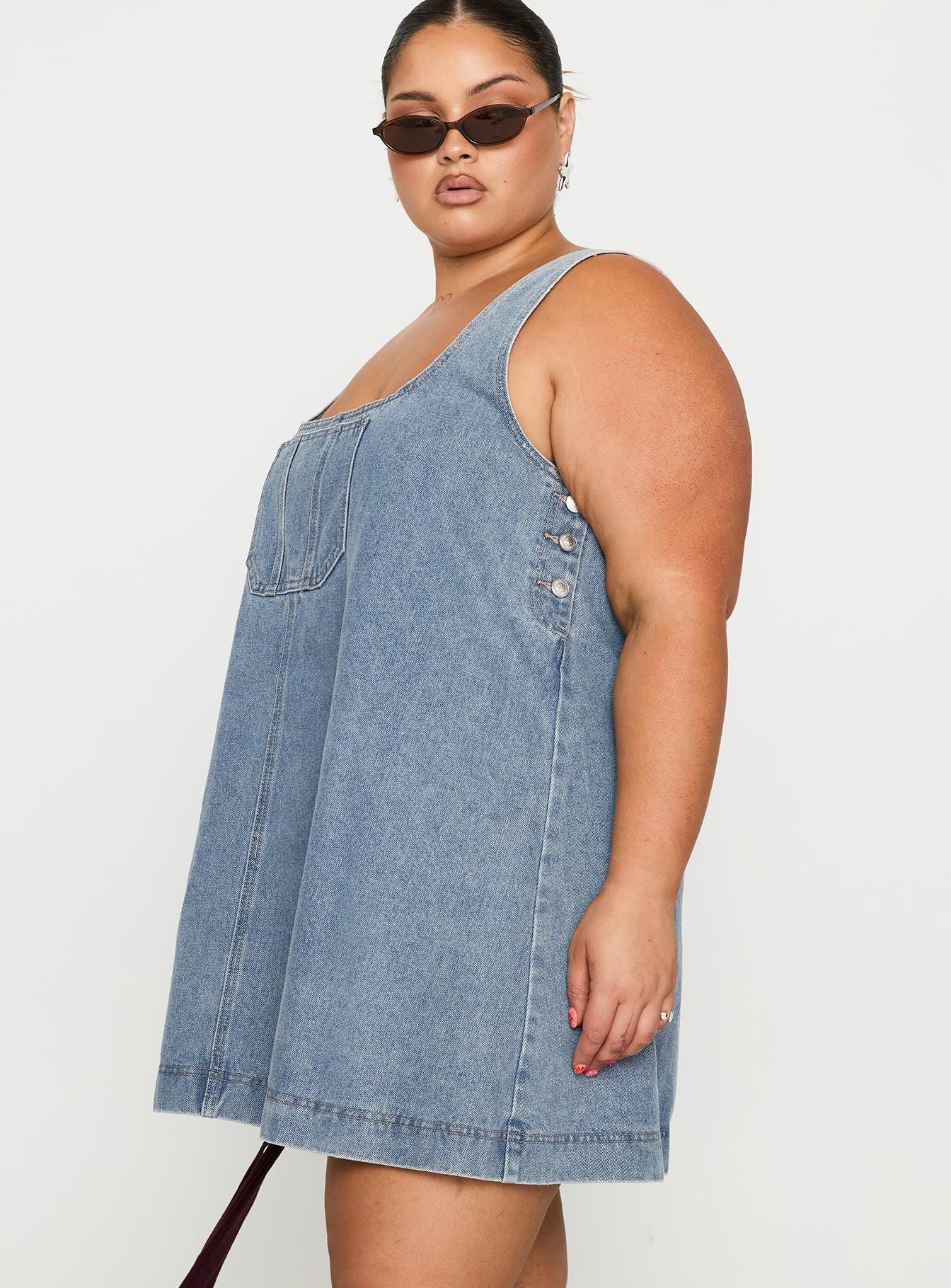 side view of model wearing Princess Polly State Of Mind Mini Dress Blue Denim Curve Scoop Neck 