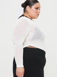 side view of model wearing Princess Polly Pratt Long Sleeve Top White Curve Full Sleeves High Neck 