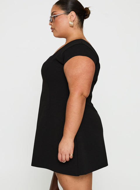 side view of model wearing Princess Polly Sylvette Mini Dress Black Curve Scoop Neck 