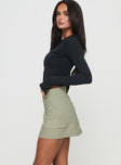   side view of model wearing Princess Polly Gonzales Mini Skirt Olive Mini Skirts 