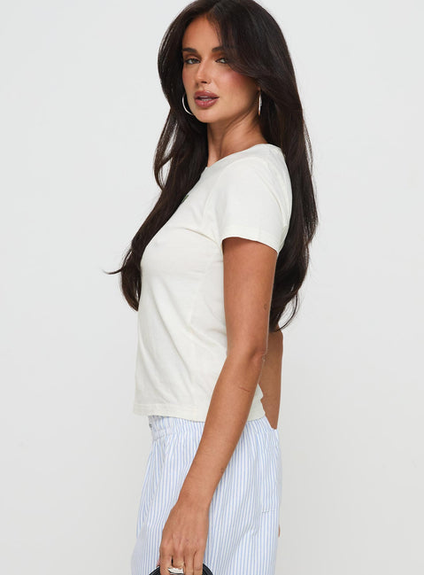 side view of model wearing Princess Polly Tease Me Top Cream Short Sleeves Crew Neck 