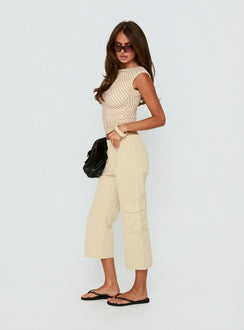 side view of model wearing Princess Polly Indee Cropped Cargo Pants Beige Mid Rise Pants Pants 