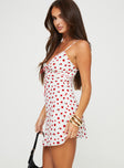 side view of model wearing Princess Polly Karena Mini Dress White / Red Floral Petite Plunger 