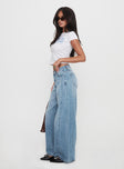 side view of model wearing Princess Polly Ringer Low Rise Wide Leg Jeans Blue Mid Rise 