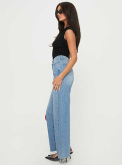 side view of model wearing Princess Polly Henesey Raw Hem Jeans Mid Wash Tall High Waisted 
