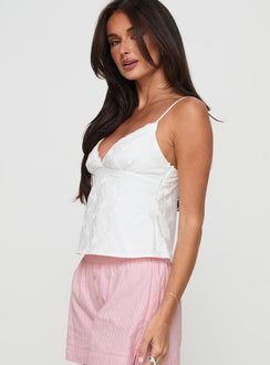 side view of model wearing Princess Polly Astraia Top White Sleeveless Plunger 