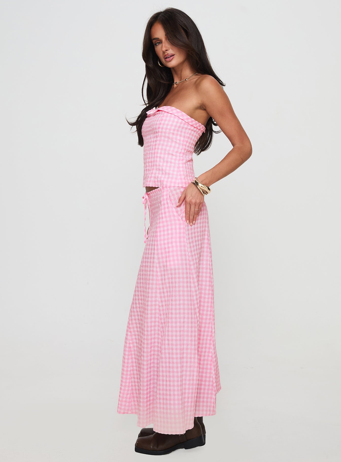   side view of model wearing Princess Polly Carmino Maxi Skirt Pink Check Maxi 