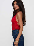 side view of model wearing Princess Polly Only Angel Halter Top Red Sleeveless Plunger 