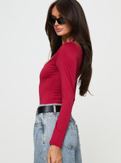 side view of model wearing Princess Polly Ellery Bodysuit Red Long Sleeve Tops 