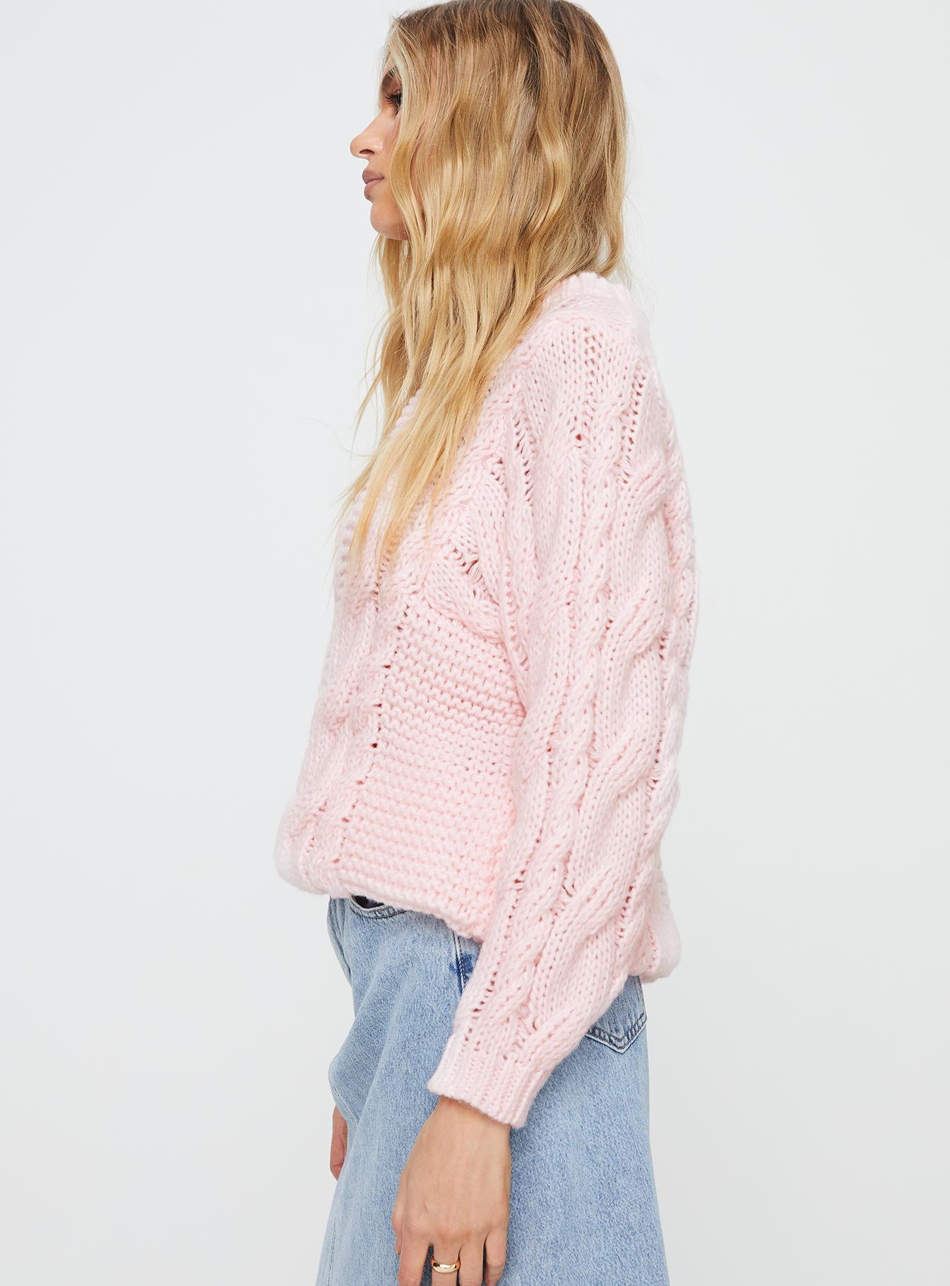 side view of model wearing Princess Polly Ellison Cable Knit Sweater Blush Pink Long 