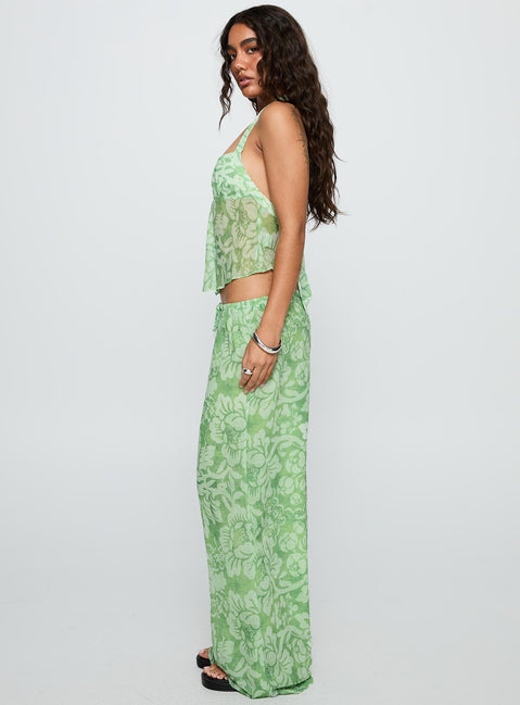 side view of model wearing Princess Polly Finesse Pants Green Floral High Waisted Pants 