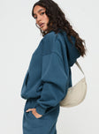 side view of model wearing Princess Polly Princess Polly Hooded Sweatshirt Block / Cursive Text Slate 