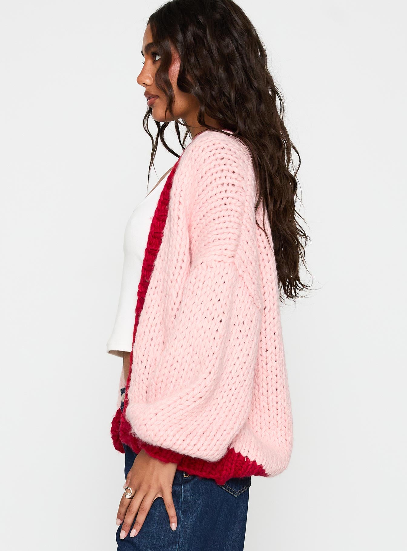 side view of model wearing Princess Polly Lester Knit Cardigan Pink / Red Long 
