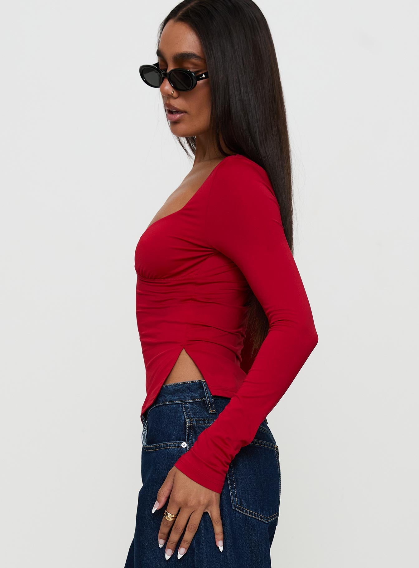 side view of model wearing Princess Polly Keane Long Sleeve Top Red Full Sleeves Sweetheart 