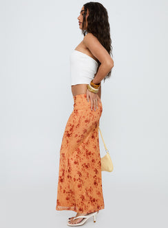   side view of model wearing Princess Polly Shepherd Maxi Skirt Orange Multi Maxi 