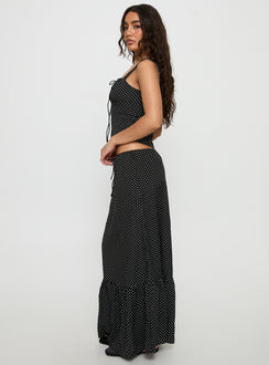   side view of model wearing Princess Polly Modern Girl Maxi Skirt Black / Polka Dot 
