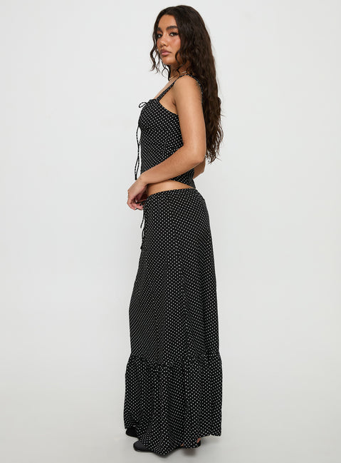   side view of model wearing Princess Polly Modern Girl Maxi Skirt Black / Polka Dot 