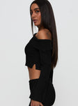 side view of model wearing Princess Polly Sina Off The Shoulder Top Black Full Sleeves Asymmetric Neckline 