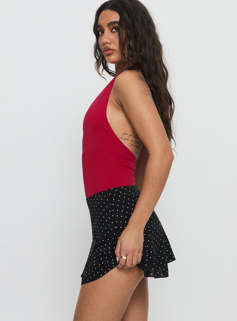   side view of model wearing Princess Polly Sonsie Mini Skirt Black / White Polka Mini Skirts 