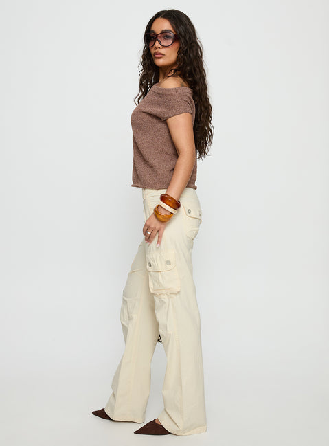 side view of model wearing Princess Polly Remmi Cargo Pants Cream Mid Rise Pants 