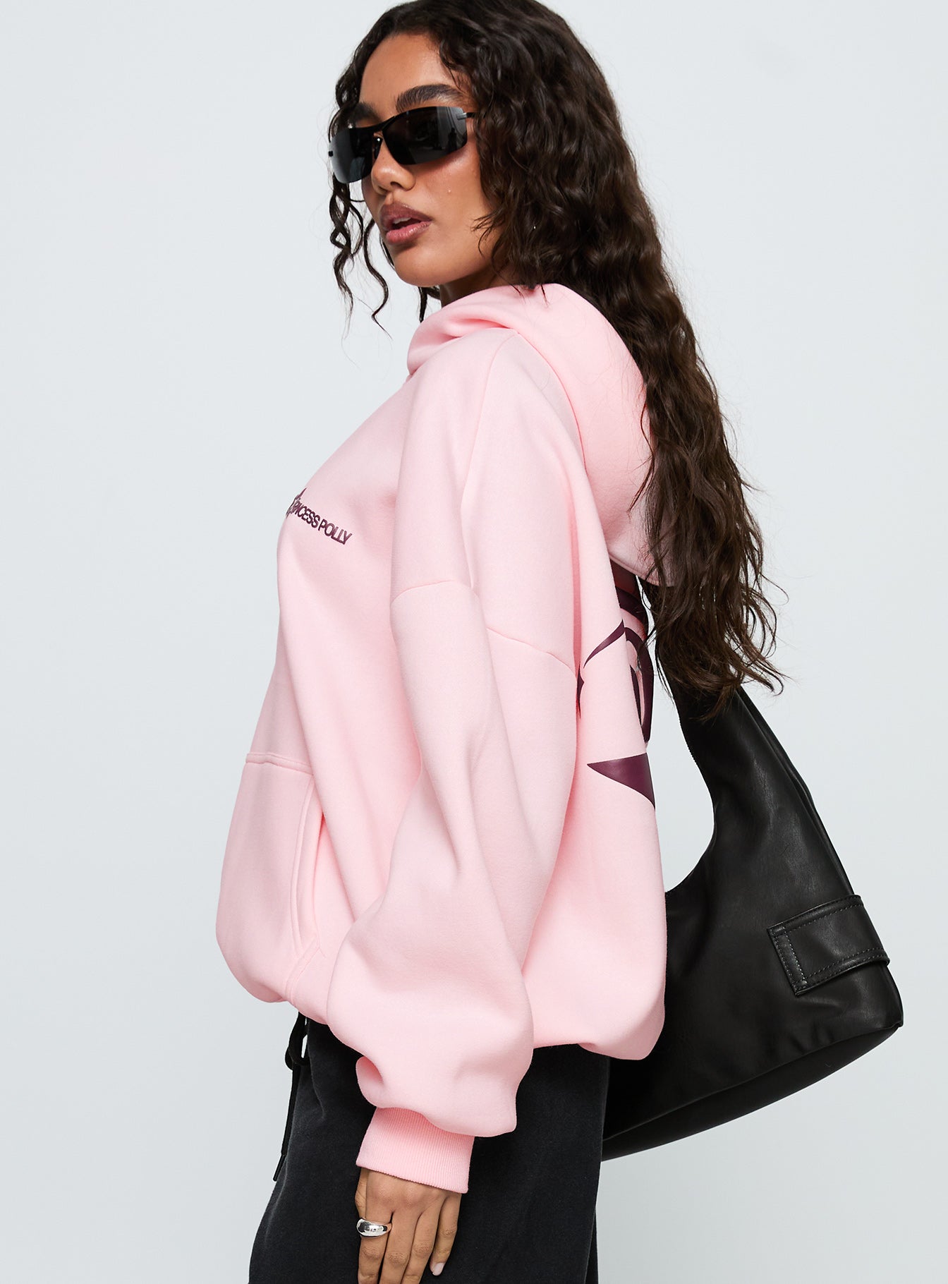 side view of model wearing Princess Polly Starblazer Princess Polly Graphic Hoodie Pink 