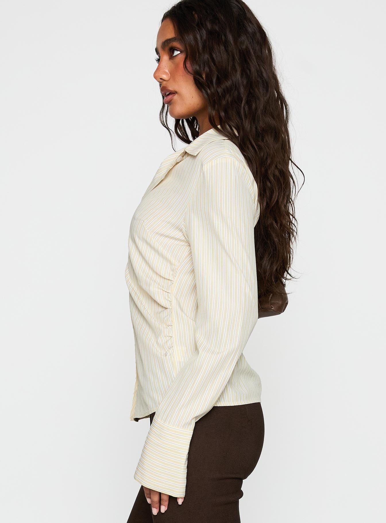 side view of model wearing Princess Polly Rush Hour Long Sleeve Top Yellow Stripe Full Sleeves V-Neck 