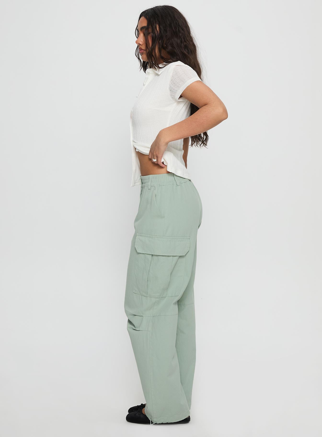 side view of model wearing Princess Polly Elanthea Cargo Pants Green High Waisted Pants 