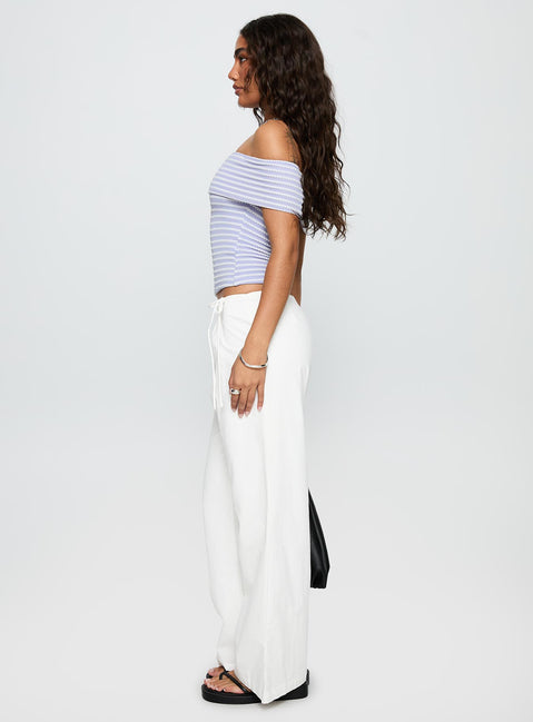 side view of model wearing Princess Polly Leyah Tie Side Pants White Low Rise Pants 