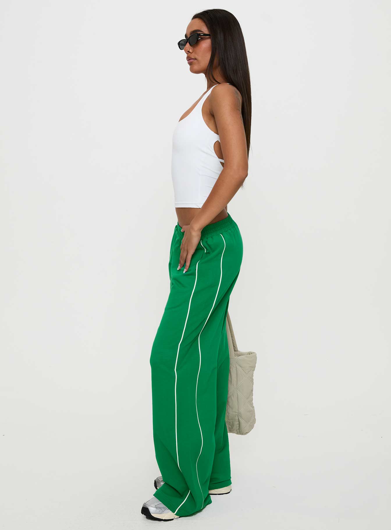 side view of model wearing Princess Polly Field Day Track Pants Green High Waisted Pants 