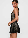 side view of model wearing Princess Polly Delamere Lace Mini Dress Black Straight Neck 