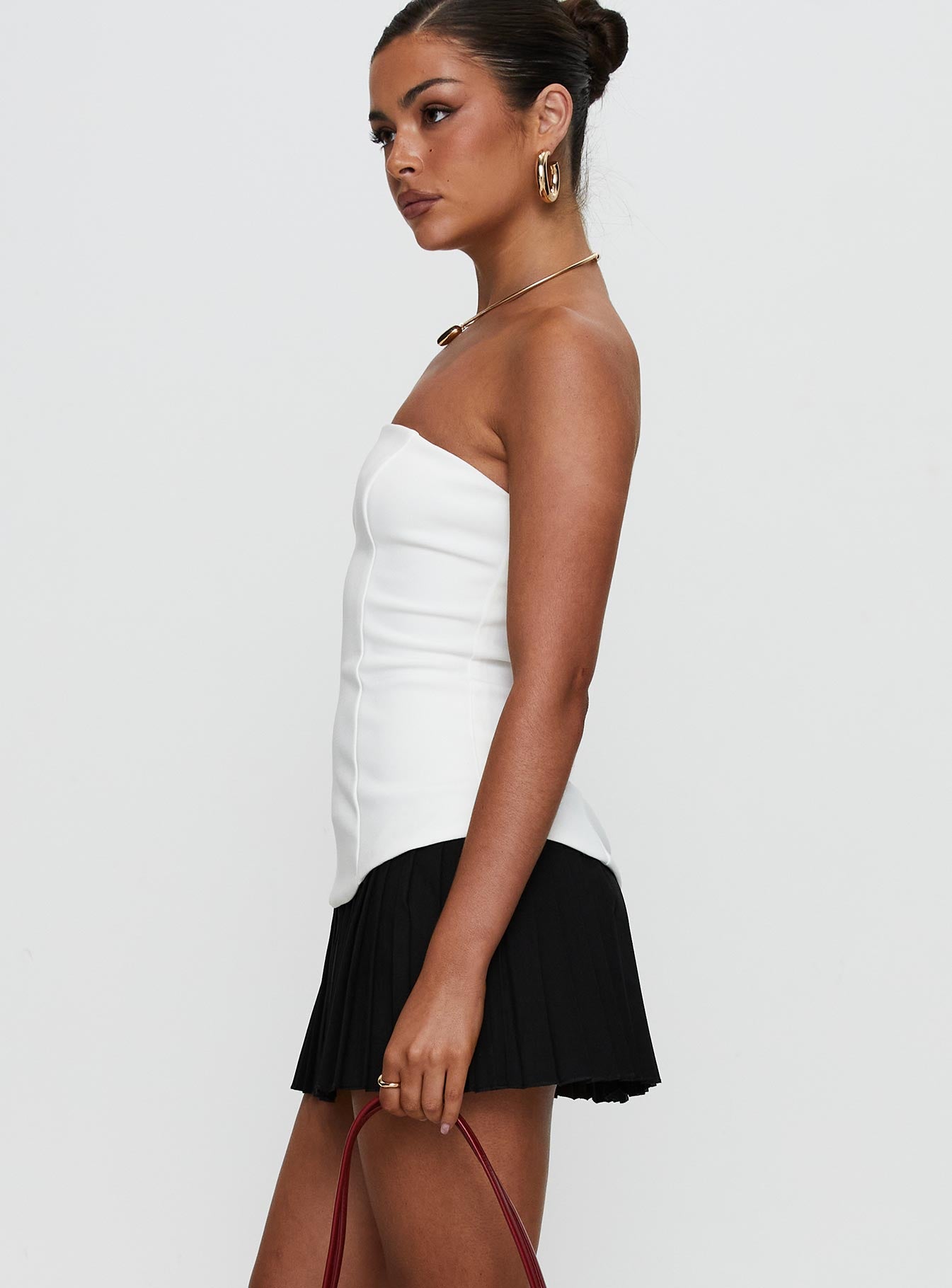 side view of model wearing Princess Polly Obsessed Strapless Mini Dress White Straight Neck 