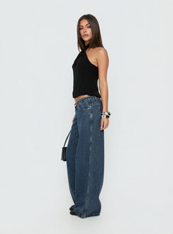 Presenting Picco Ultra Low Rise Wide Leg Jeans womens-jeans in dark blue wash side view of model wearing Princess Polly