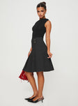   side view of model wearing Princess Polly Dereveko Pleated Midi Skirt Black Pinstripe Knee 