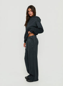 Showcasing black Baggy Sweatpant in womens regular pants with wide-leg mid-rise silhouette side view of model wearing Princess Polly