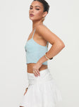 side view of model wearing Princess Polly Killian Top Blue Sleeveless Sweetheart 