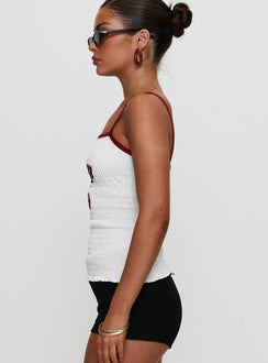 side view of model wearing Princess Polly Cherrie Ties Shirred Graphic Top White Sleeveless Square Neck 