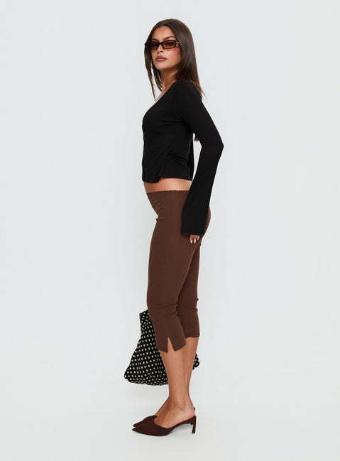 side view of model wearing Princess Polly Baseline Rib Capri Pants Chocolate Mid Rise Pants 