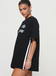 side view of model wearing Princess Polly Goal La Oversized Tee Black Half Sleeves Crew Neck 