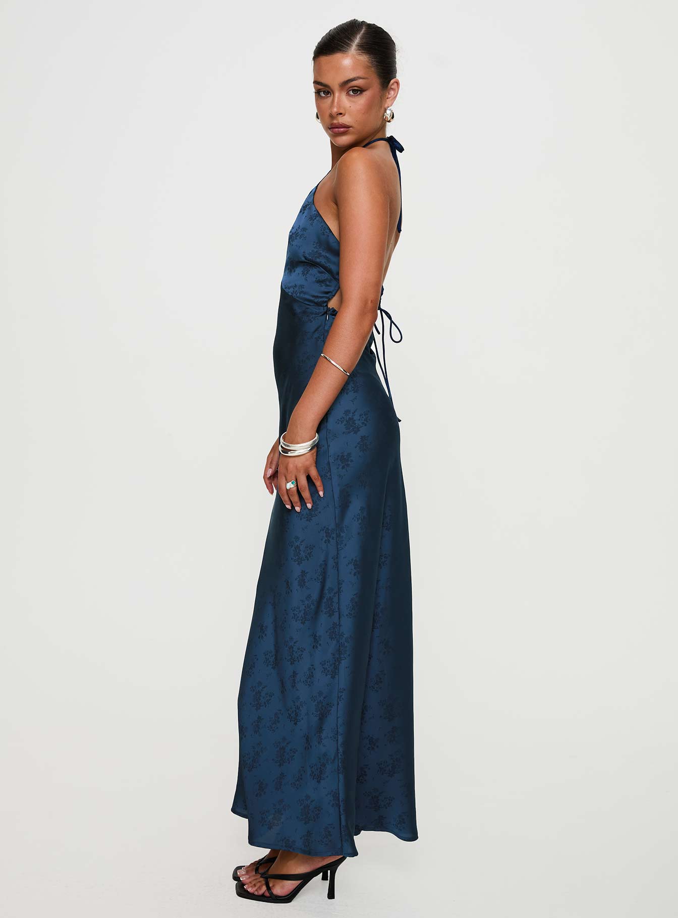 side view of model wearing Princess Polly Limosina Halter Maxi Dress Navy Plunger 