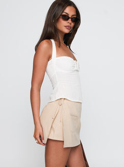 side view of model wearing Princess Polly Gigi Wrap Skort Beige High Waisted Shorts 