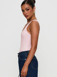 side view of model wearing Princess Polly Baseline Rib Bodysuit Pink Sleeveless 