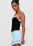 side view of model wearing Princess Polly Renaissance Corset Lace Top Black / White Sleeveless Scoop Neck 