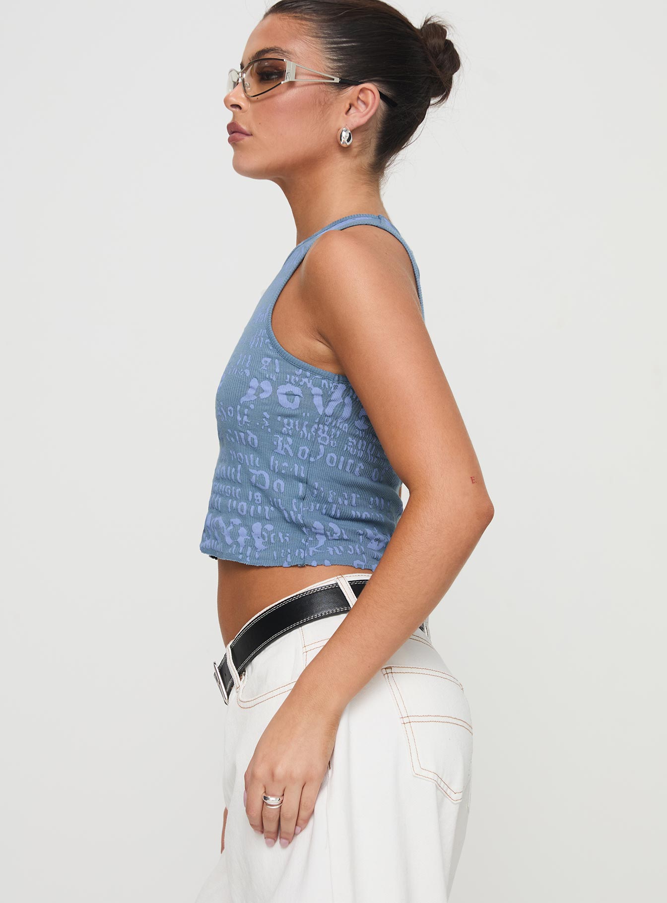 side view of model wearing Princess Polly Abdiel Top Blue Sleeveless Crew Neck 