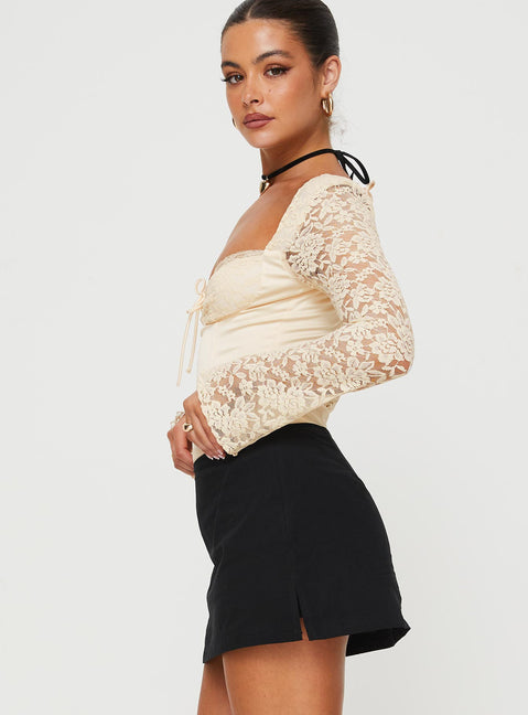 side view of model wearing Princess Polly Markwell Long Sleeve Bodysuit Cream Full Sleeves Sweetheart 