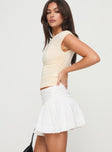   side view of model wearing Princess Polly Bubble Broderie Mini Skirt White Mini Skirts 