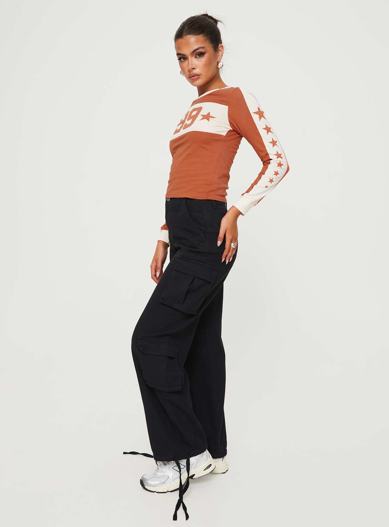 side view of model wearing Princess Polly Driscoll Cargo Pants Washed Black Mid Rise 