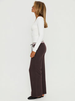 side view of model wearing Princess Polly Felisha Low Waist Knit Pants Brown Low Rise Pants 