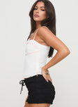 side view of model wearing Princess Polly Thatcher Top White Sleeveless straight 